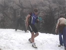 Gavin, Luke and Andrew have fun on the first patch of snow we have found as we near the top